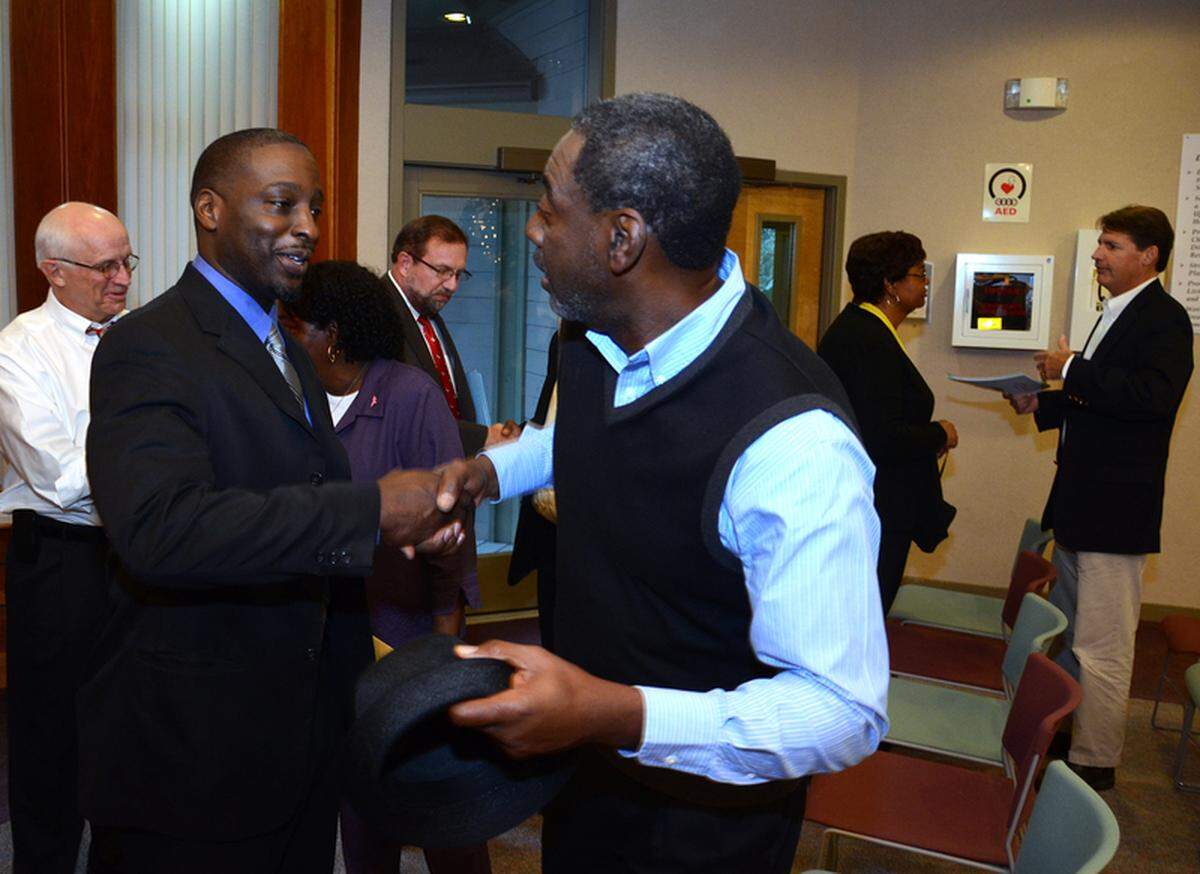 Curtis Barnwell, right, congratulates Marc Grant, left, after Grant, John McCann and Lee Edwards were sworn in Tuesday as Hilton Head Island Town Council members. Grant defeated fellow native-islander Bill Ferguson in November for the Town Council seat representing Ward 1. McCann won his seat in Ward 6 by just 46 votes in a race against Jim Collett Jr. to replace Ken Heitzke, who did not seek re-election. Edwards fended off three challengers to his Ward 3 seat. Later Tuesday, the council elected Ward 2 Councilman Bill Harkins as mayor pro tem. Council also called on state legislators to reduce property taxes on second homes and business properties. For more on that discussion, go to blogs.islandpacket.com/PacketBlotter.