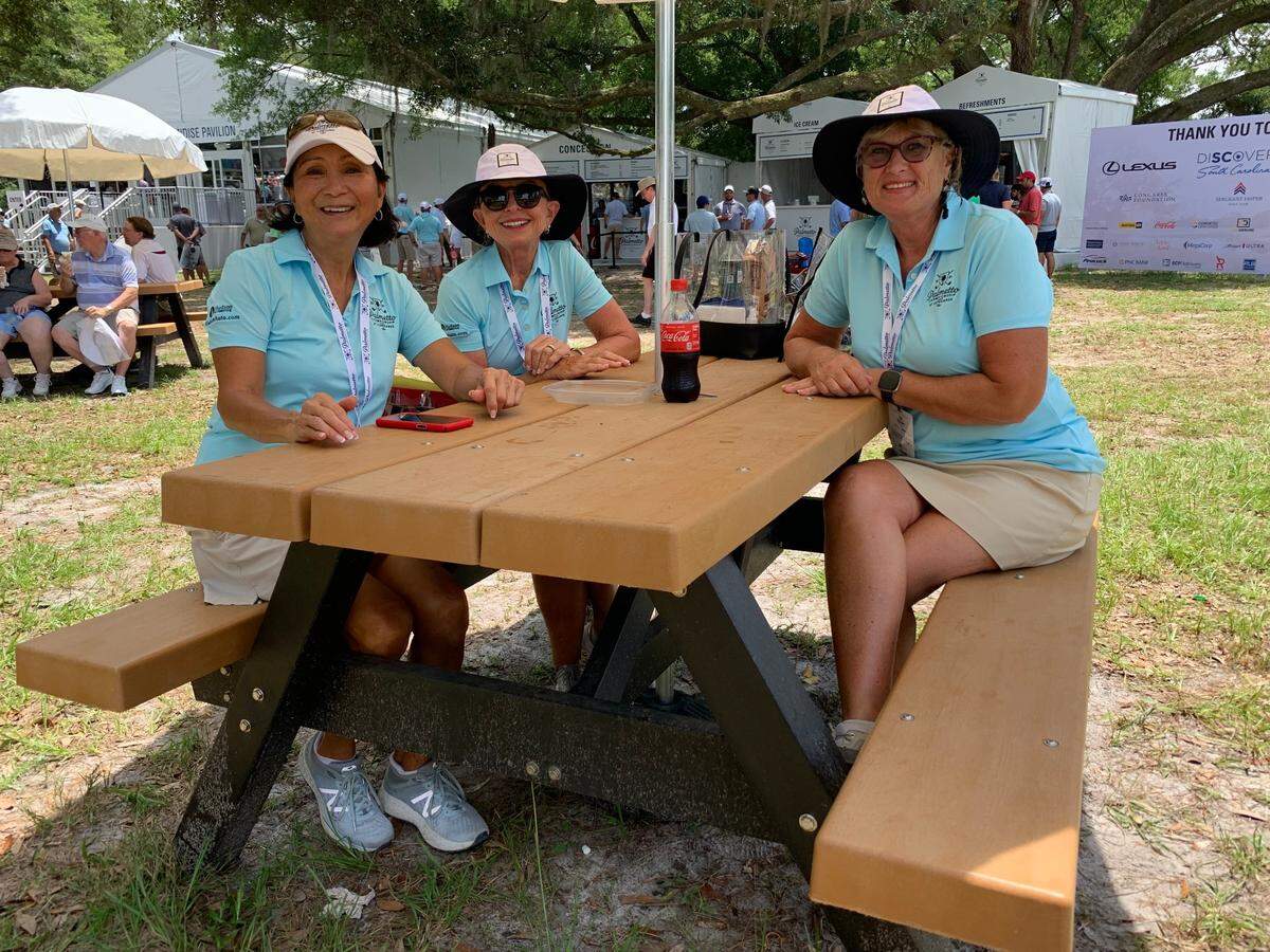 Volunteers Irene Snowberger, Debbie Orbacz and Linda Lambert (left to right) sit at a picnic table near in the back nine on Thursday, June 10, 2021, at the PGA Tour’s Palmetto Championship at Congaree in Jasper County.