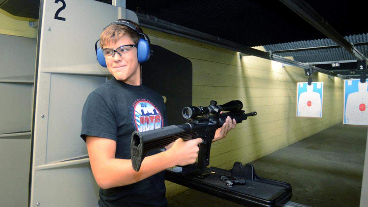 Daniel Luther, 14, of Hilton Head Island smiles after firing a semiautomatic assault rifle on Sunday at Palmetto Indoor Range & Sporting Goods in Hardeeville.
