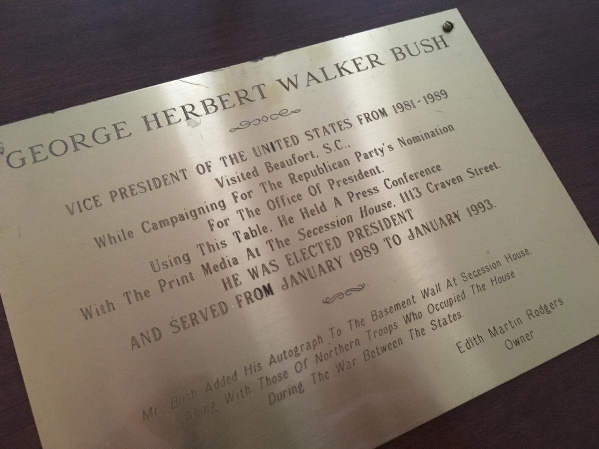 A plaque on the dining room table of Beaufort resident Edie Rodgers marks the time George H.W. Bush visited Beaufort while campaigning for president in 1988.