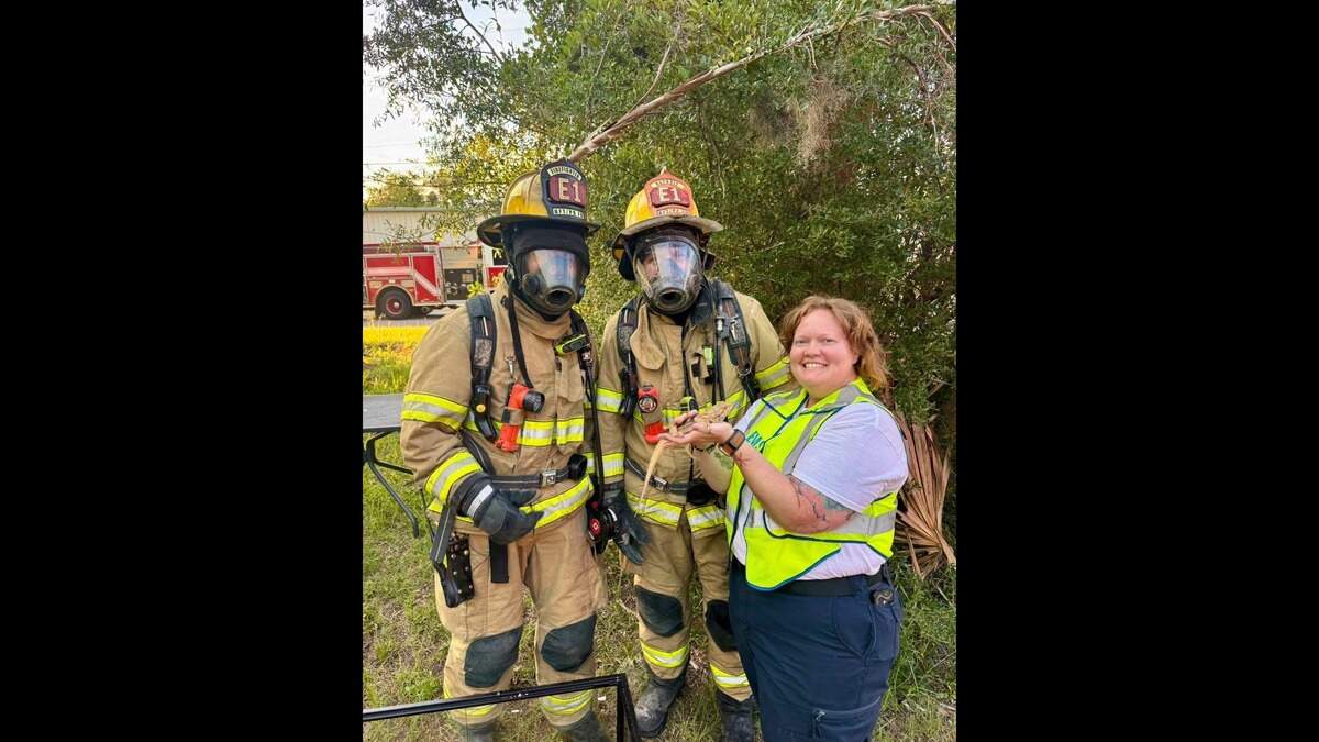 Firefighters and emergency responders pose with some unusual pets that were rescued in a Monday house fire in Beaufort.