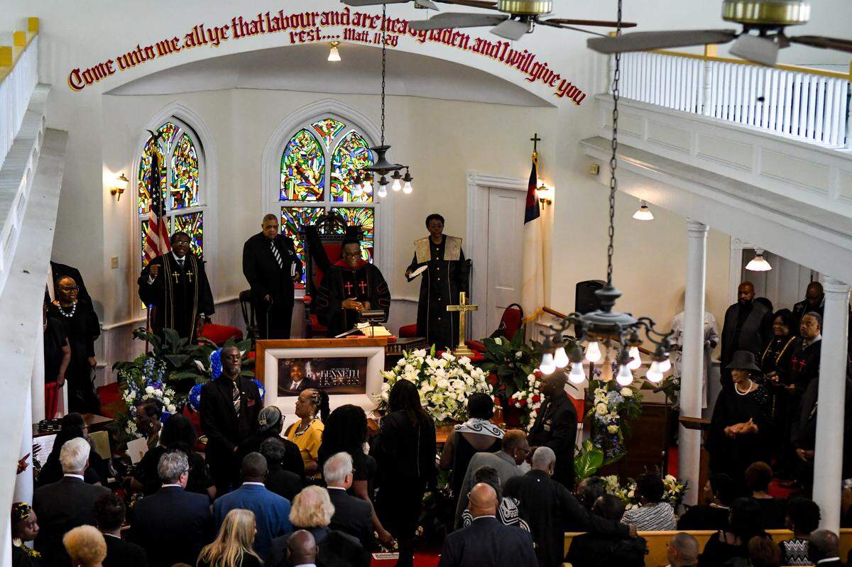 People proceed into the sanctuary and view the casket holding Rev. Kenneth Hodges at his celebration of life funeral on May 3, 2025, the Tabernacle Baptist Church in Historic Downtown Beaufort.
