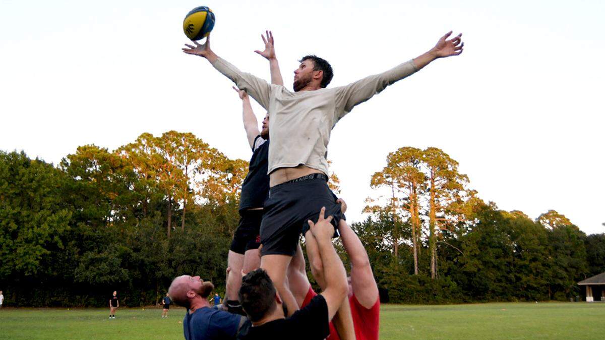 Craig Ryan, 27 and a charter captain on Hilton Head reaches for the inbound pass on a line-out drill during practice at Chaplain Community Park. Ryan was part of the squad when it closed it’s doors in 2017 and hasn’t played since but he’s back for the 2023 season.