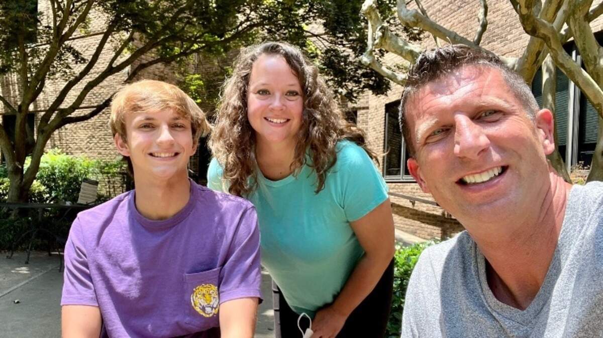 Anderson Jones, a Beaufort teen who suffered a spinal cord injury after a bad fall from a Fripp Island roof, smiles with his parents, Lesley and Jeremy Jones before their trip to Los Angeles with Dream on 3, an organization geared towards helping young people achieve their athletic dreams.
