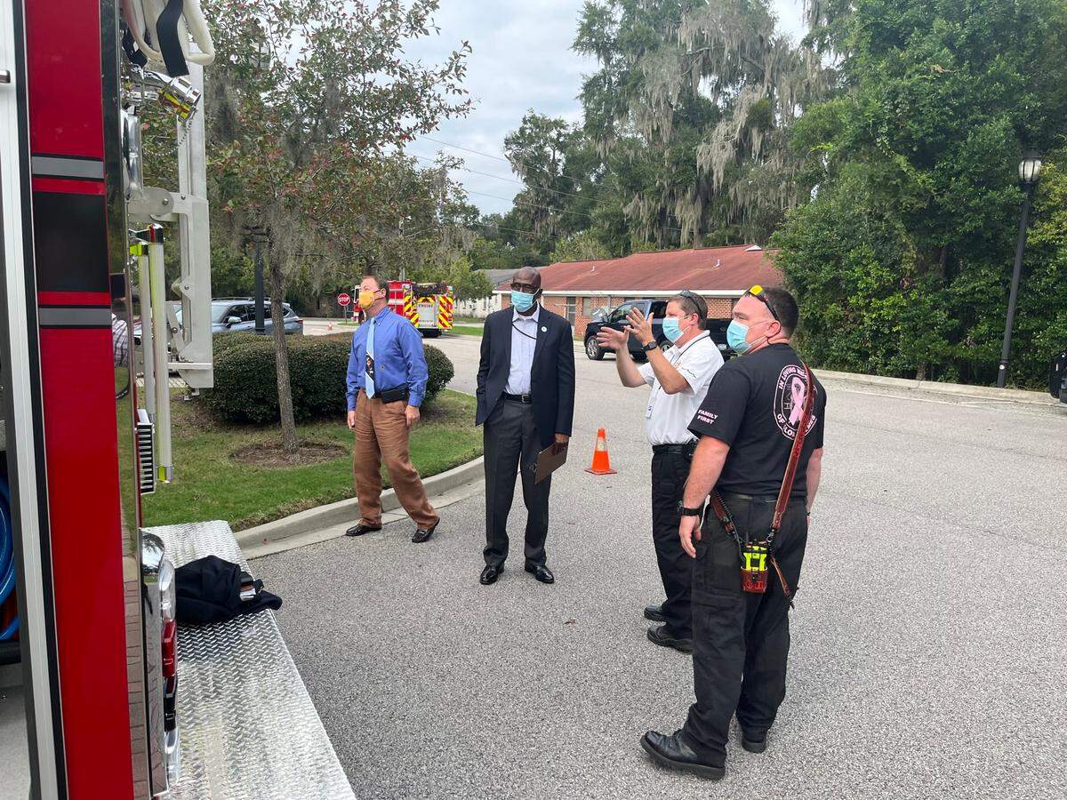Fire Chief Tim Ogden and Clint Holmes of the Beaufort-Port Royal Fire Department explain the features of a new fire truck to Beaufort City Council members Mitch Mitchell and Mike McFee.