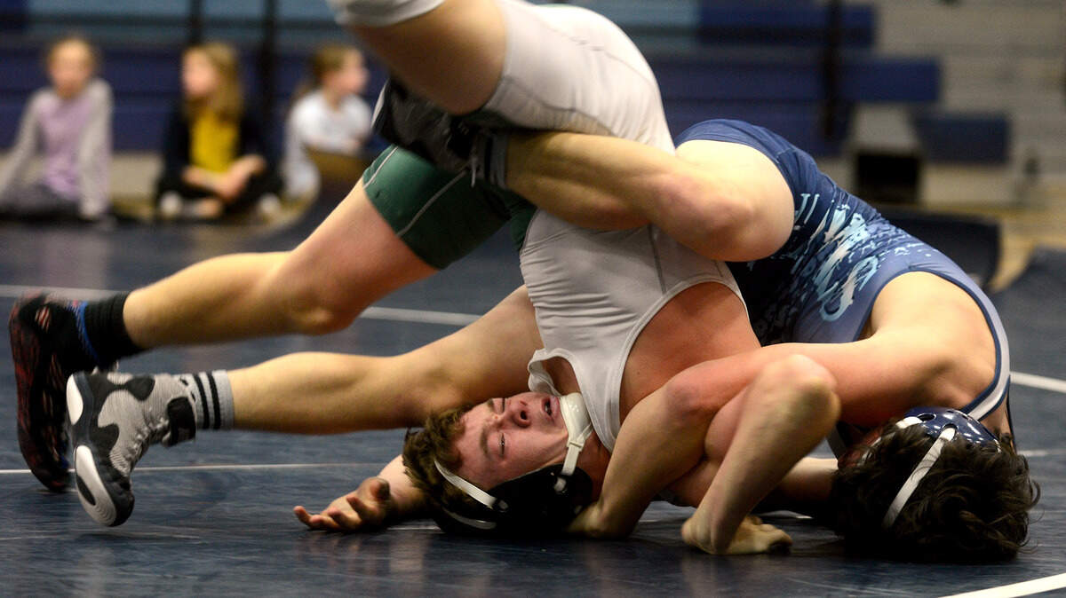 Beaufort's Jeffrey Smyth is flipped by Hilton Head Island's Alex Braden during their 145-pound match Dec. 8, 2015 at Hilton Head Island High School on Hilton Head Island.