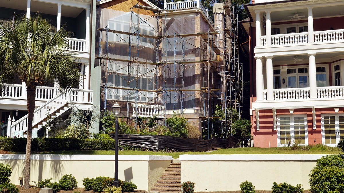 Danielle Smith's home on Yacht Club Drive in Windmill Harbour is shown under construction last week. After a decade of unsuccessful legal battles and two years to secure a loan, repairs are finally underway.