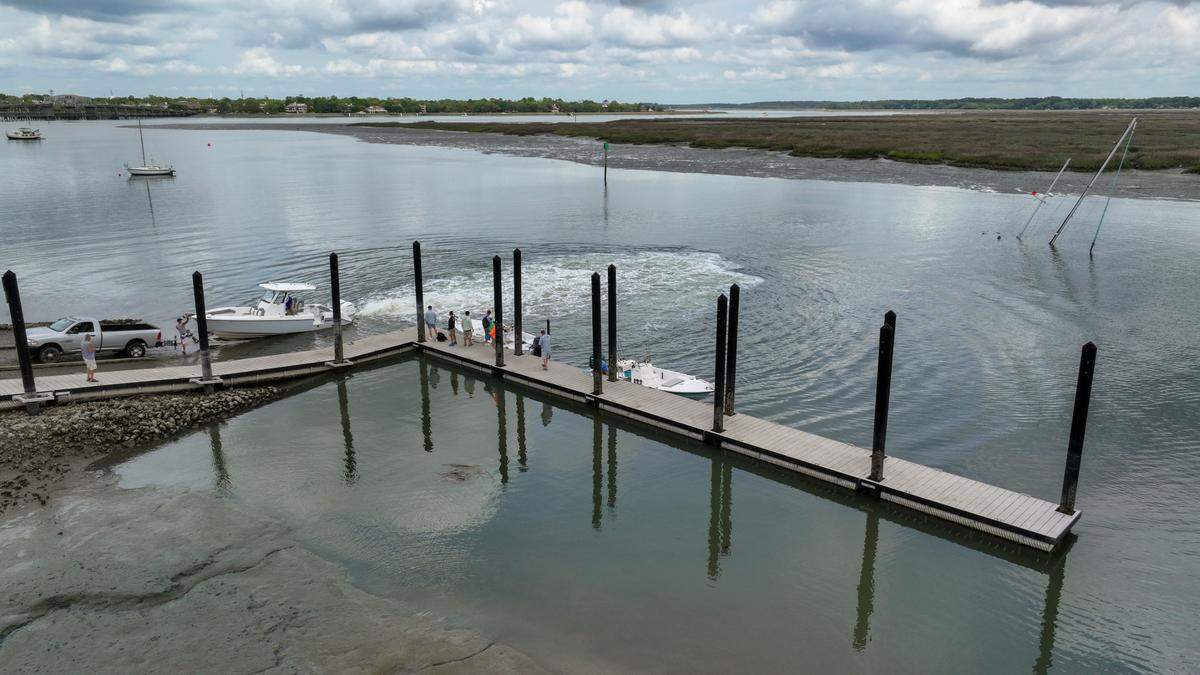 Masts from a sunken sailboat can be seen protruding from Factory Creek on April 23, 2025, directly across from the Whitehall Boat Landing as people take their boat out of the water on Ladys Island.