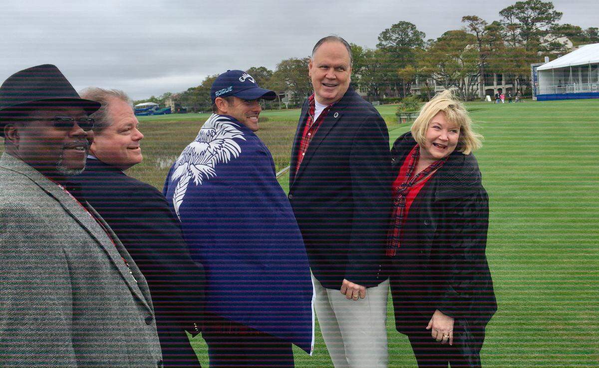 RBC Heritage Presented by Boeing champion Wesley Bryan, a South Carolina native, wears the state flag presented to him by state Rep. Jeff Bradley, standing to his right, in 2018. Bradley said it flew over the Statehouse on March 13 as the legislature proclaimed it Wesley Bryan Day in South Carolina. Posing after the opening ceremony with Bryan are other state representatives, from left, Michael F. Rivers Sr.,  Weston Newton, and Shannon Erickson.