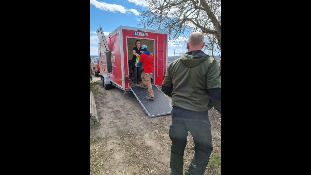 Supplies for Dogbus Transporting Paws Saving Lives being loaded onto one of several trucks delivering food and other goods to animals in Ukraine.
