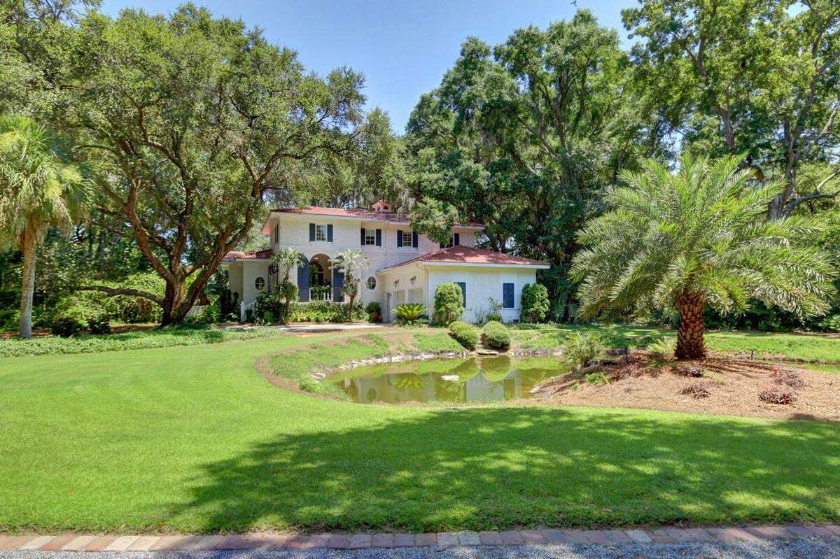 Besides the main house, the Camelot Farms property includes a 3-bedroom guesthouse, a 14-stall barn, 2-stocked ponds, several other barns, miles of trails, and a six-slot RV campground.