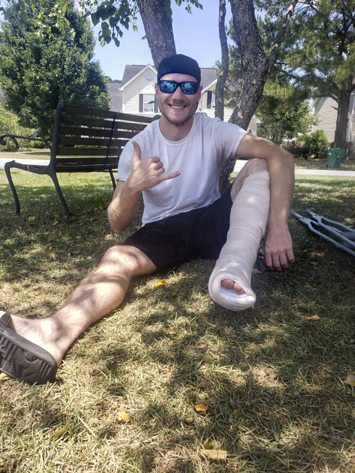 Wyatt Bowman poses outside his home on May 28 with his leg wrapped in gauze. Bowman was bitten by a shark May 23 while swimming off the coast of Hilton Head Island.
