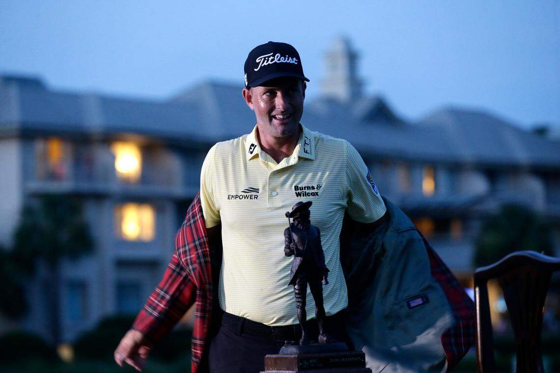 Webb Simpson poses with the championship trophy after winning the RBC Heritage golf tournament, Sunday, June 21, 2020, in Hilton Head Island, S.C. (AP Photo/Gerry Broome)