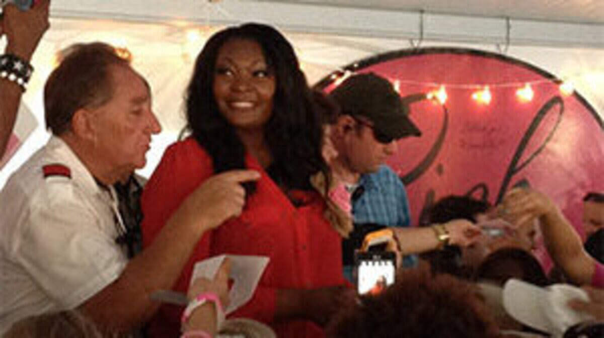 American Idol winner Candice Glover signs autographs Thursday night at the Pink Partini pre-show party at Tanger 1 outlet center.
