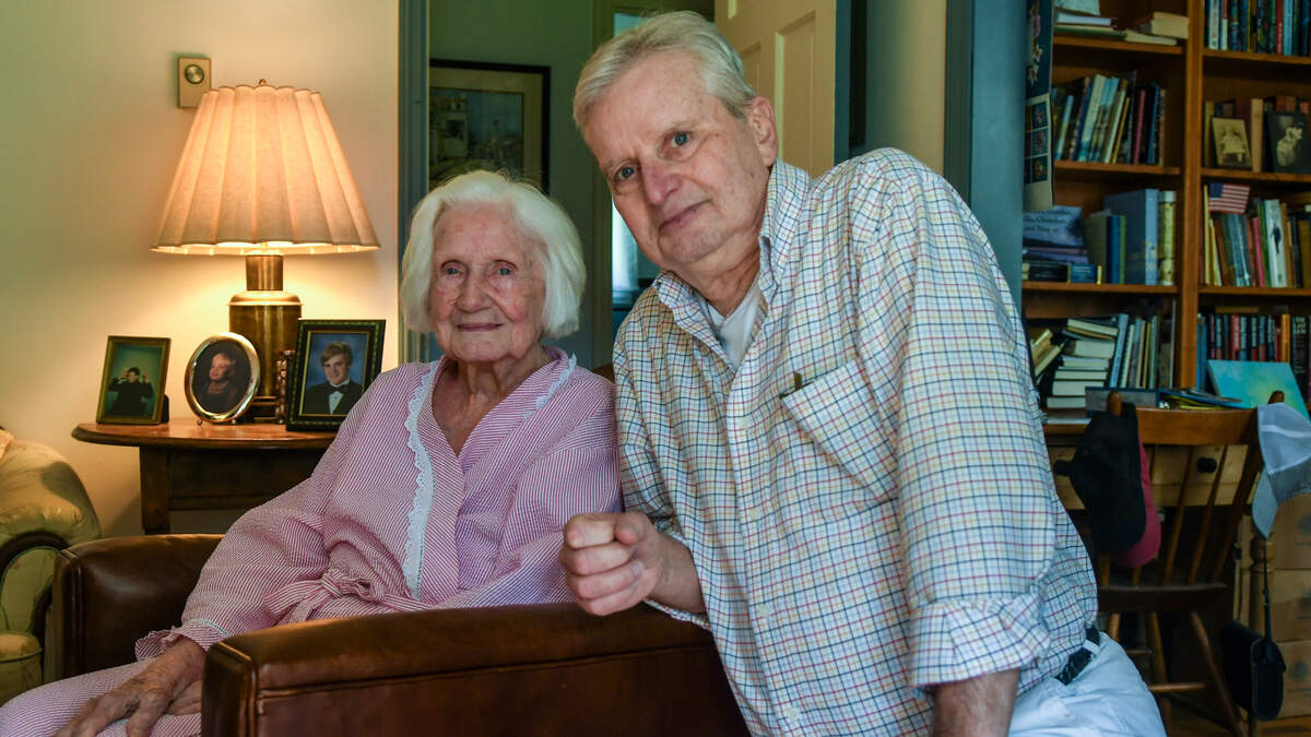 Therese Colquhoun, 93 and her son, John Colquhoun pose for a photo at their home in The Point neighborhood on Aug. 18, 2023, in Beaufort’s Historic District. The Colquhoun family’s — whose Beaufort roots trace back for more than 300 years — home likely built before 1820 was destroyed by The Great Fire of 1907.