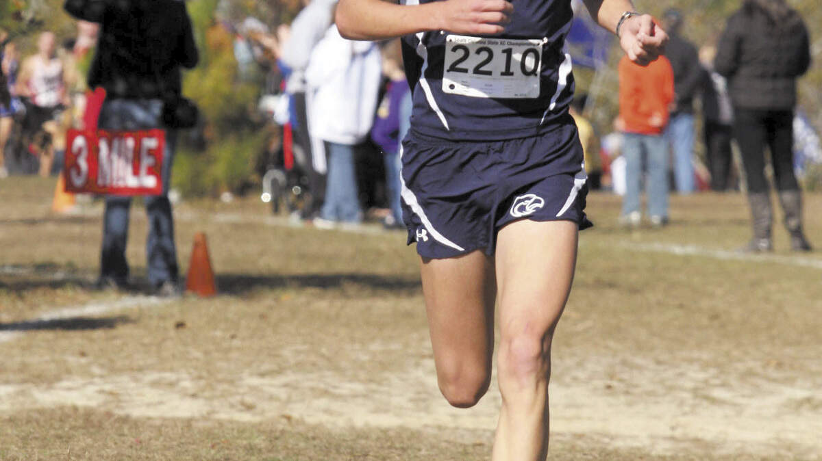 Hilton Head Island High's Jack Manesiotis runs during the 2011 Class 3-A cross country state championships at Sandhills Research Center in Columbia. Manesiotis plans to run in college at Florida.