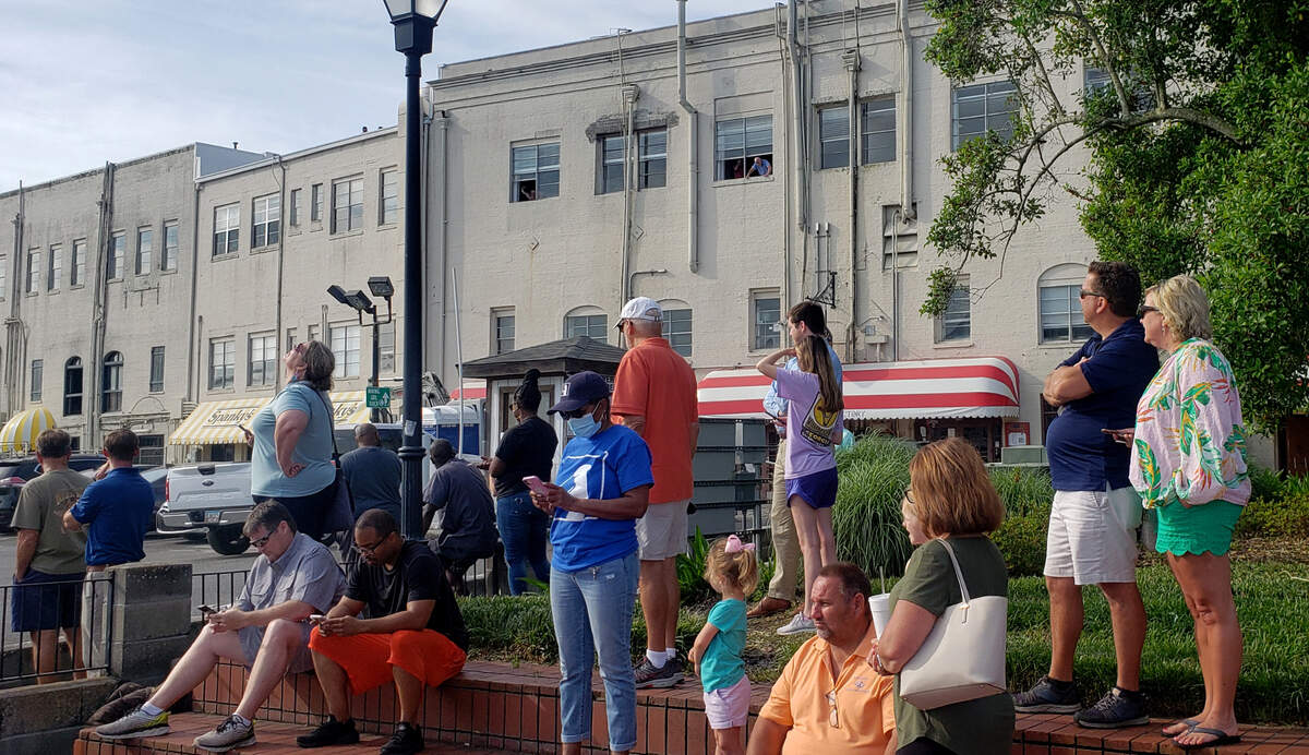 Before the arrival of the massive cargo ship the Marco Polo, people watch pilots practice their drone flying skills on Wednesday, May 26, 2021.