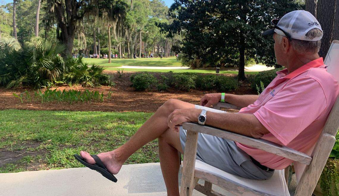 Renting a house in Sea Pines, Lyle Van Wyk watches golfers putt on hole 7 of the RBC Heritage from the comfort of his patio.