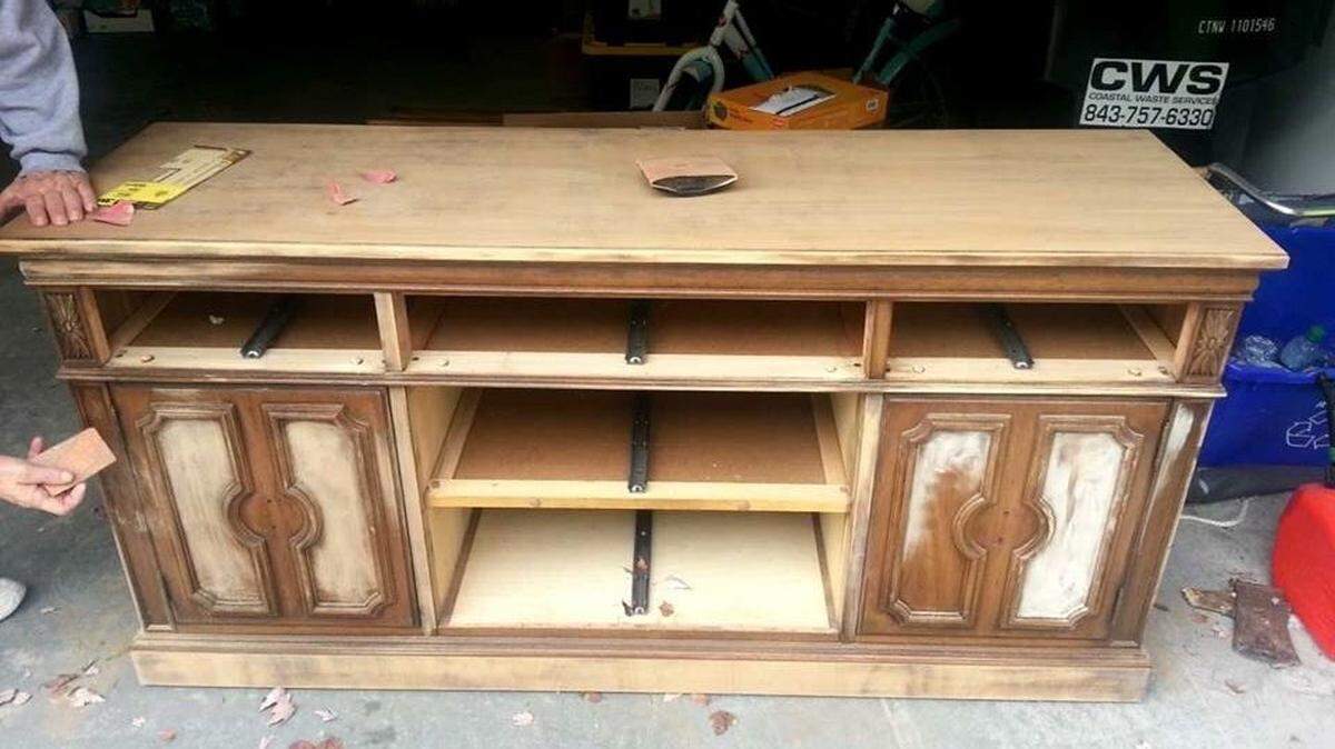 To start the transformaton from thrift store dresser to entertainment center, the piece was first sanded and primed.