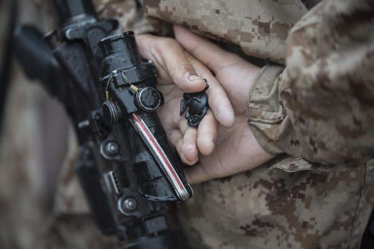 A Marine holds the Eagle, Globe and Anchor emblem after emerging from The Crucible at Marine Corps Recruit Depot Parris Island. 