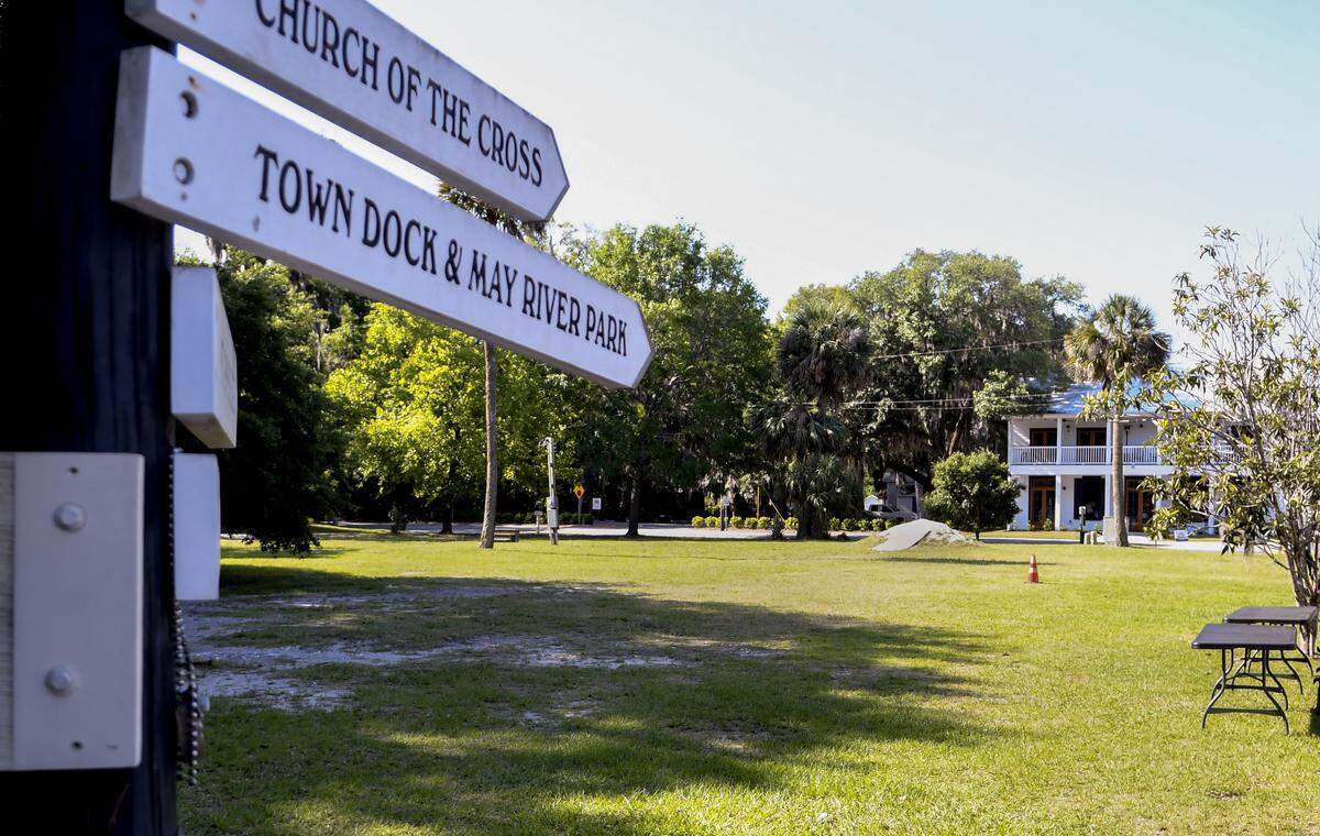 The directional sign on Calhoun Street points to historical sites and businesses within the historic district as a makeshift bike ramp, background, rises from the earth along Bridge Street as seen on Thursday, May 7, 2020, in Old Town Bluffton. A developer wants to build three multi-use buildings that would fill this now empty lot.