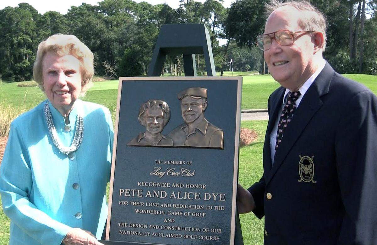 Pete and Alice Dye pose for the media and members of the community at Long Cove Club on Hilton Head Island on Friday, Oct. 9, 2015 with a plaque dedicated and honoring  them for the construction of the private community's golf course. 