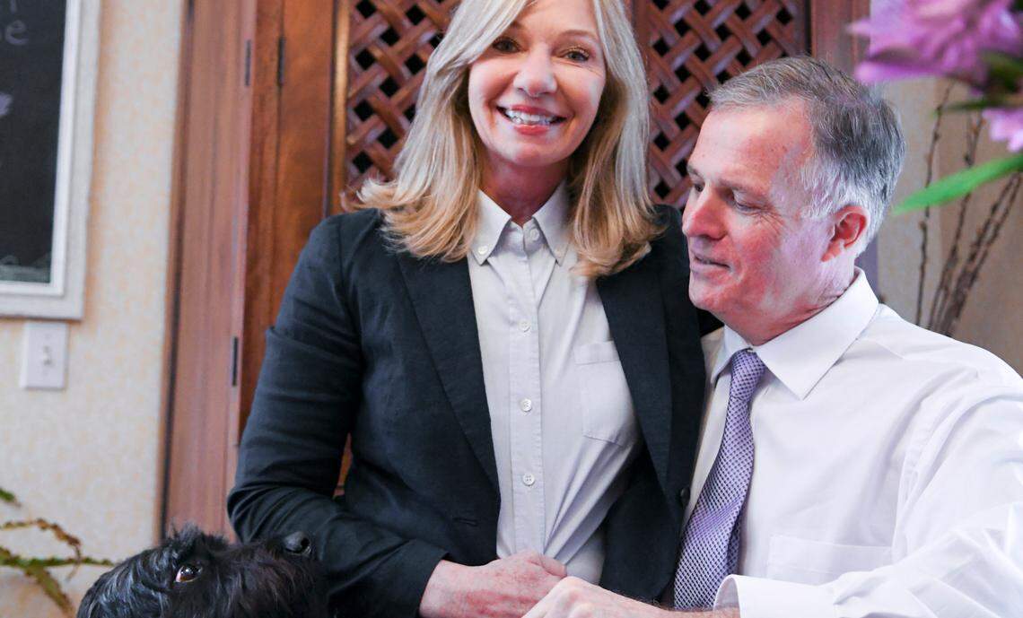 Susan and Rob Neal sit for a portrait in their Beafort, S.C. home on Sunday, Dec. 16, 2018 as their dog, XX, checks to make sure everything is okay. Susan testified at the trial of Isaiah Gadson, the man who murdered her boyfriend and raped her when she 15-years-old was identified by DNA that the Beaufort County Sheriff’s Office tested and placed in a national database.