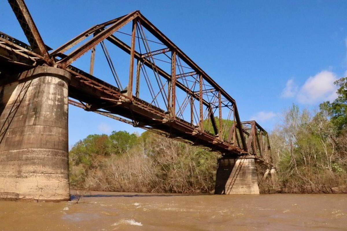 The abandoned trestle of the old Norfolk Southern railroad crosses the Altamaha River near Uvalda, Georgia, and is a reminder of man’s impact on the landscape as transportation needs ebb and flow.