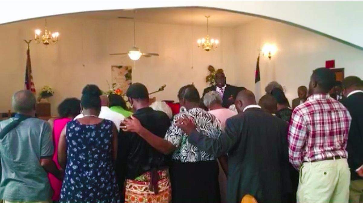 Parishioners worship during the Sunday morning service at St. John AME Church in Ridgeland, where Clementa Pinckney first preached at age 13. The state senator was among nine people killed in the shooting at Emanual AME church in Charleston last week.
