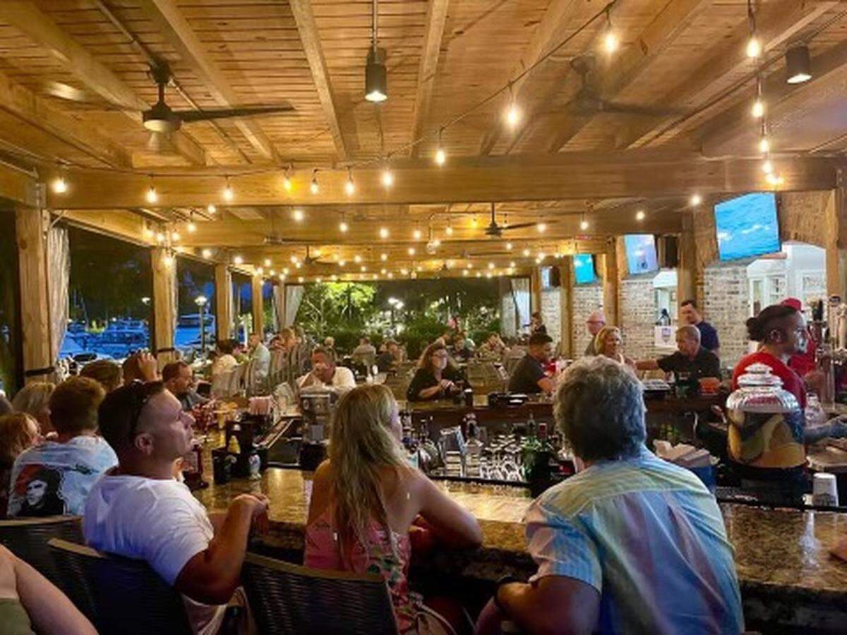 Top Dawg Tavern is open at Shelter Cove Harbour and Marina on Hilton Head. It has both indoor and patio seating.