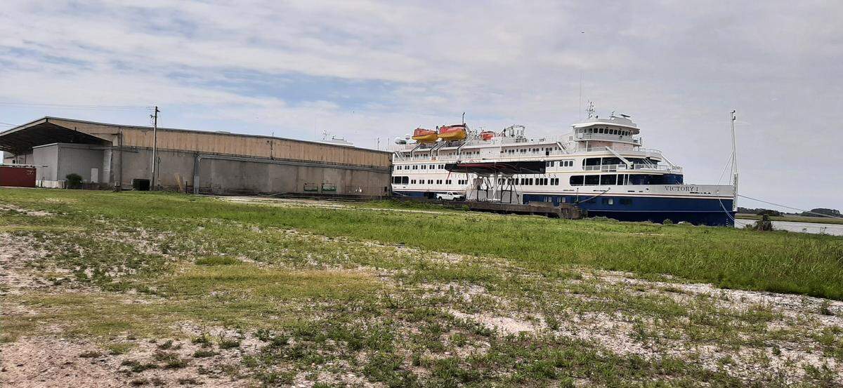 A cruise ship is parked at the old State Ports Authority terminal building, which is part of redevelopment plans on the town’s waterfront.