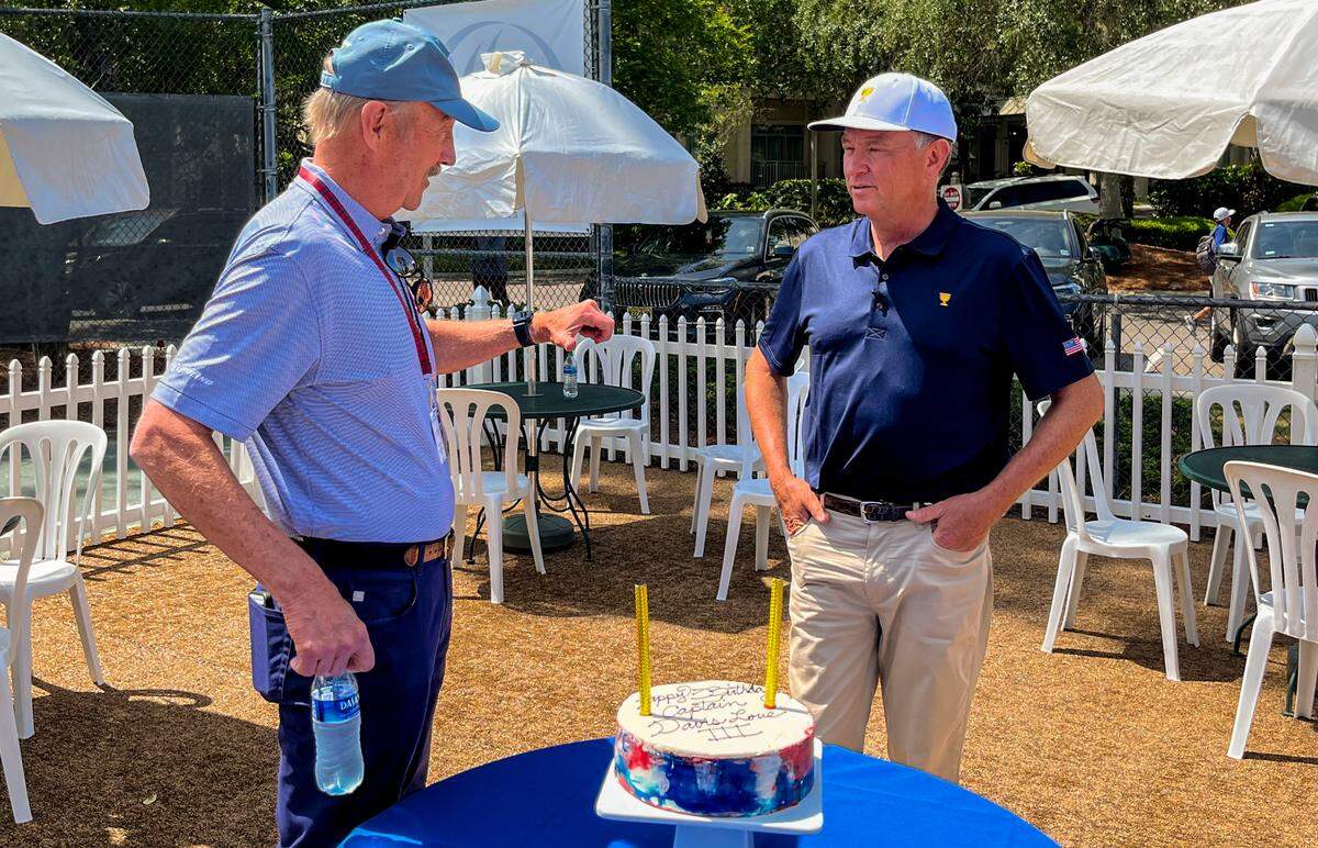 Tennis legend Stan Smith, left, talks with golf’s Davis Love III in front of Love’s birthday cake celebrating his 58th birthday on Wednesday, April 13, 2022 at the RBC Heritage Presented by Boeing at Harbour Town Golf Links in Sea Pines on Hilton Head Island.