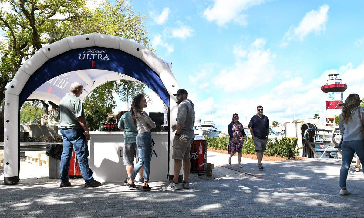 Spectators gather at a Michelob Ultra beverage tent in Harbour Town during the 2019 RBC Heritage Presented by Boeing.
