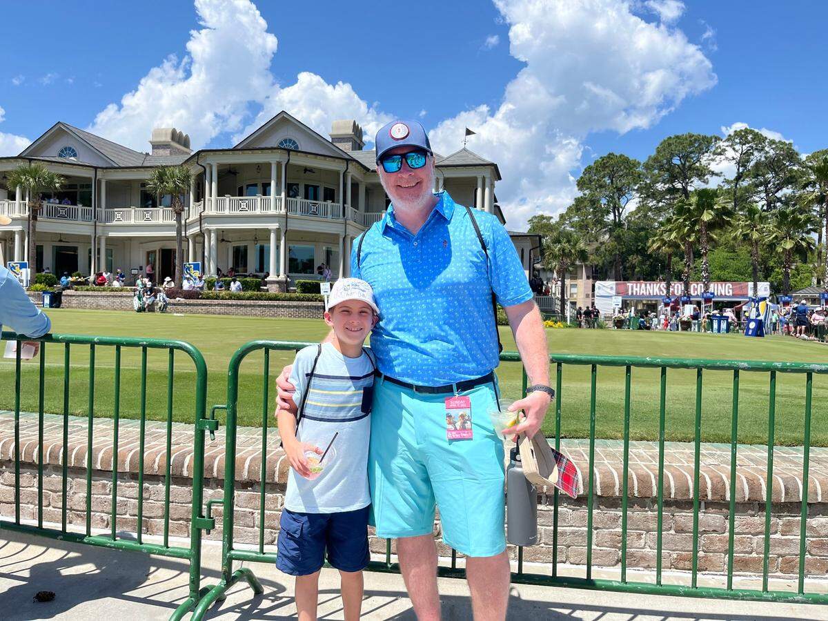8-year-old Finley Houlihan with his father, Ryan, on the last day of RBC Heritage Presented by Boeing. Finley has collected the autographs on hit hat from as many golfers as he can while on spring break for the tournament on Hilton Head Island.