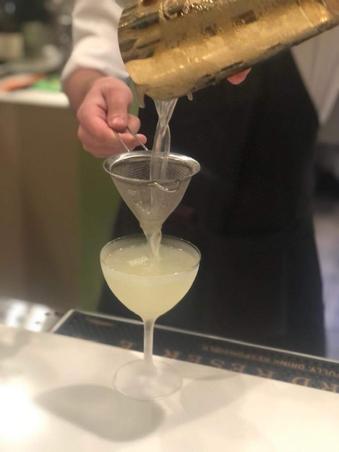 Bartender Eric Bisdinnette prepares a drink at Chez Georges Bistro and Bar.