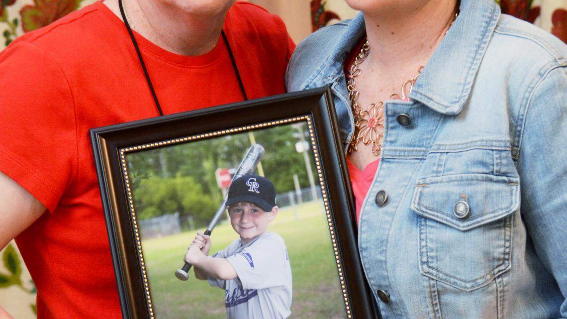 Kelly Vannoni, right, and her sister, Margaret Nowlin, are photographed on Thursday holding a picture of Vannoni's 9-year-old son, Leo, who died on Feb. 15, 2014 after a tough two-year battle with leukemia. Today -- following through on a promise she made to the boy to do great things in his name -- Nowlin has created a fundraiser -- Leo's Legacy 5K Family Fun Day -- to give back to the community that did so much to help her nephew during his illness. The fundraiser is set for 3 p.m. Saturday at Oscar J. Frazier Park in Bluffton.