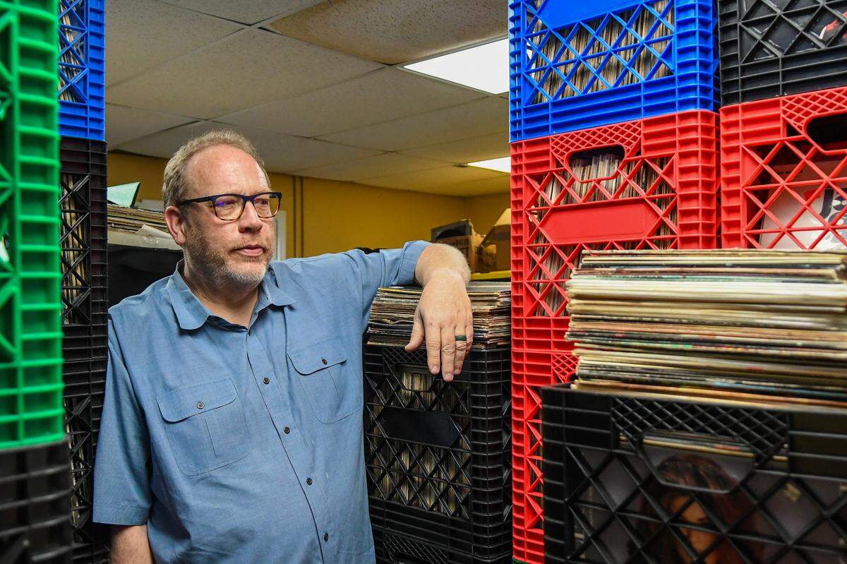 Josh Duvall, co-owner of Mojo’s Island Records, stands in a room that holds approximately 10,000 records on April 7, 2025, at the Palmetto Bay Road store on Hilton Head Island.