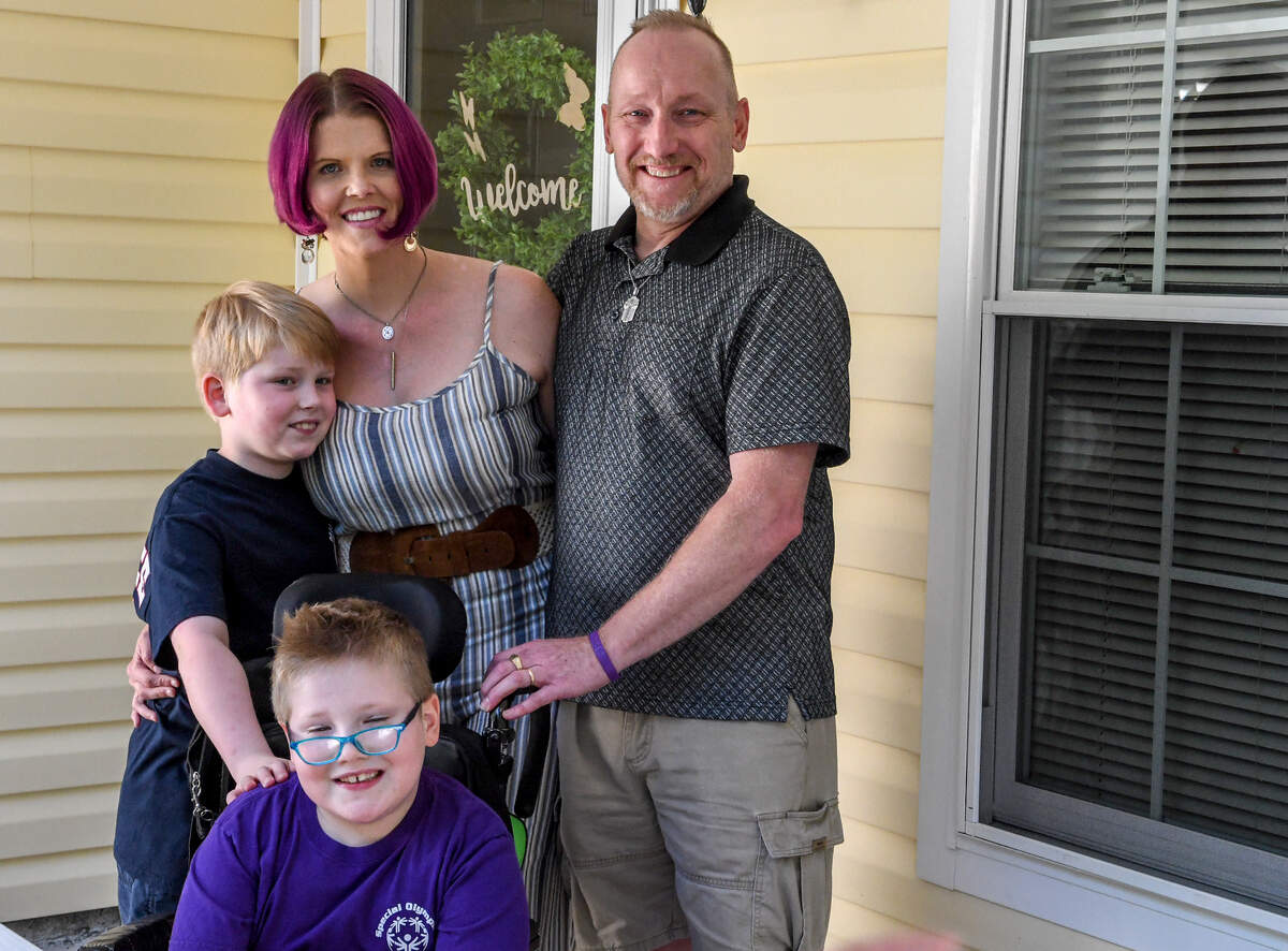 Megan Starich, top, is finally reunited with her husband, Jim Starich, clockwise, and their children, Rhett Starich, 6, and Nicholas Starich, 8, as they stand for a final photo at the Ladys Island home they must move from after their lease was terminated. Megan and their premature son Treyton, not pictured, were stuck in Wisconsin after struggling with insurance providers to determine which one would provide coverage to have their child airlifted to South Carolina. Treyton is currently at a Savannah hospital receiving care.