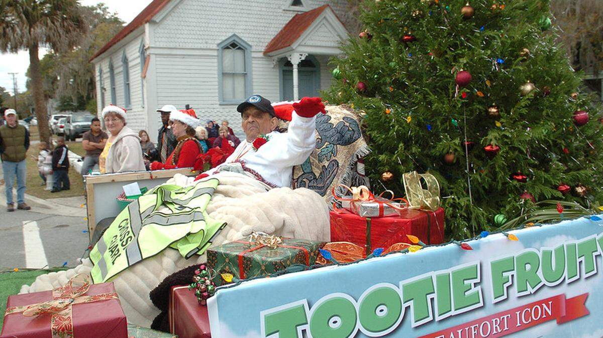 Wilson "Tootie Fruity" Bourke waves to the crowd as he heads down Carteret Street during the Beaufort Christmas Parade on Dec. 5, 2010. Dee Renwick and other downtown merchants once employed Tootie as a Downtown Sidewalk Superintendent. "I don't think Tootie ever missed an entire day of work," Renwick writes.