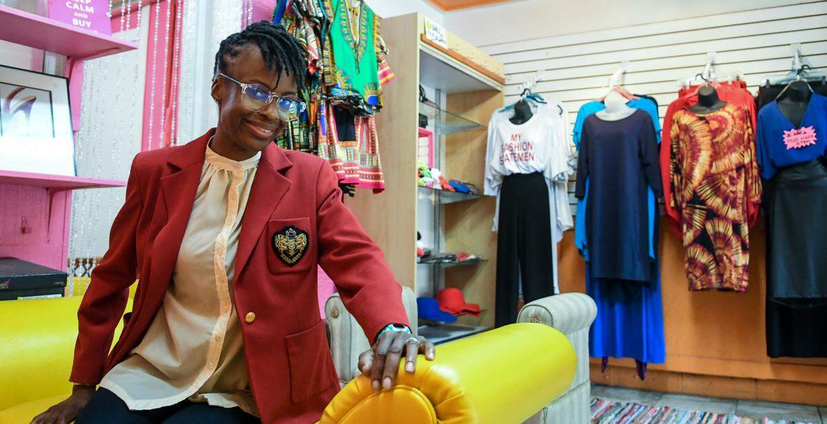 Tressa Govan, owner of Tressa’s Gullah Girl Boutique, sits for a portrait on Thursday, Oct. 22, 2020 on Hilton Head Island. Decorated with her favorite colors of pink, yellow and orange, her store is at risk of being in the path of S.C. Department of Transportation’s plan to widen U.S. 278 with another two lanes. “I’d be heartbroken if they tear by building down” Govan said after giving a tour of the shop’s fashions and accessories.