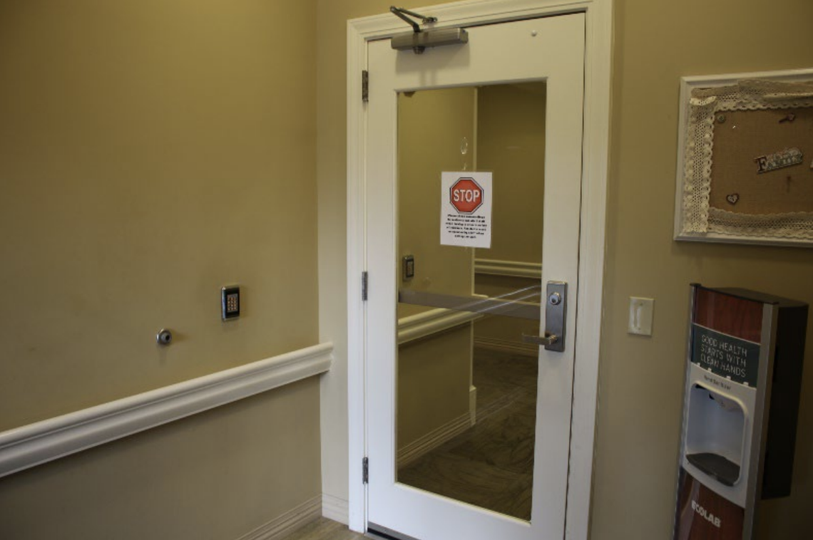 A photo taken inside The Palmettos assisted living facility in Bluffton shows a keypad-locked door that separates the “dedicated, secured” patient quarters from the rest of the facility. Family of Jack Tribble, 79, allege the patient easily bypassed the security measure, following behind a construction worker who wrongfully received the passcode from staff.