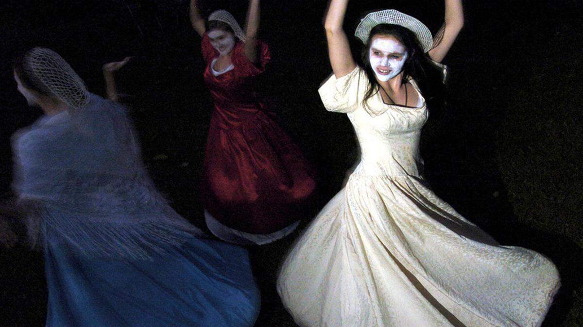 Ghostly bride Katie Edgerly, right, dances at The Garden Party with fellow ghouls Ashley Hoffmann, center, and Madeline Anderson on Friday night as part of the 19th annual Beaufort Ghost Tours through downtown Beaufort. The tours are organized by the Exchange Club of Beaufort with all proceeds benefiting the Child Abuse Prevention Association of Beaufort County.