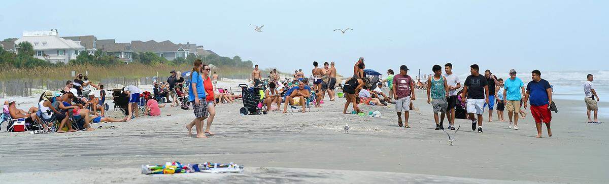 People enjoy the weather on Coligny Beach on South End in Hilton Head Island, SC on Tuesday, September 3, 2019.