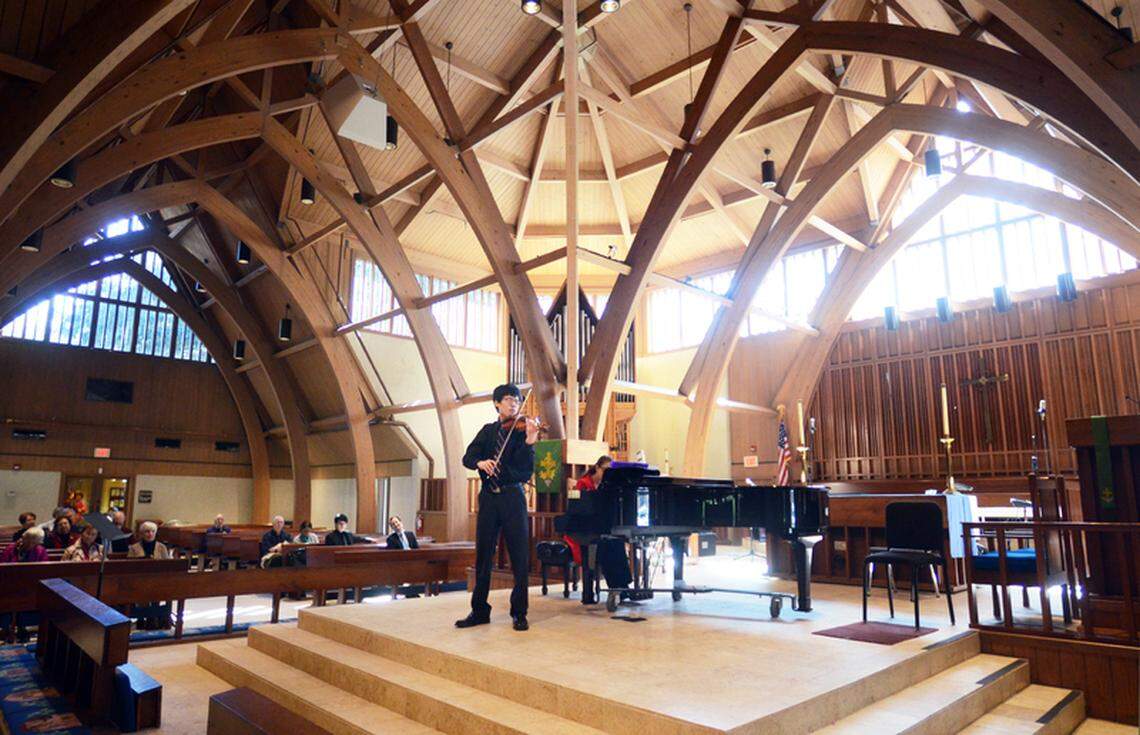 Accompanied by Karla Rocker on the piano, Yong-hun Kim plays a piece by Tchaikovsky on his violin during the Hilton Head Symphony Orchestra’s Youth Concerto Competition Concert Finals on Saturday at St. Luke’s Episcopal Church.
