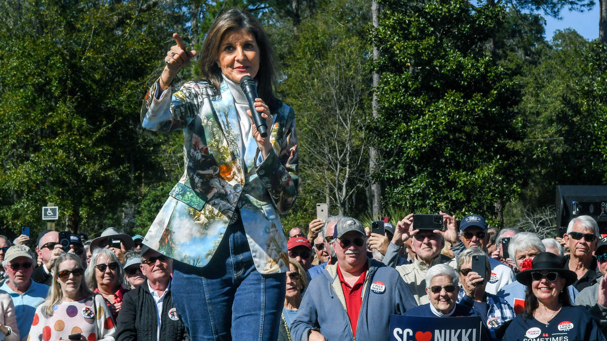Former S.C. Governor and U.S. Ambassador to the United Nations Nikki Haley turns and thanks 14th Circuit Solicitor Duffie Stone for introducing her at her political bus tour stop on Tuesday, Feb. 13, 2024 as she campaigned for the GOP presidential nominee at Bluffton Oyster Factory Park in Old Town Bluffton.