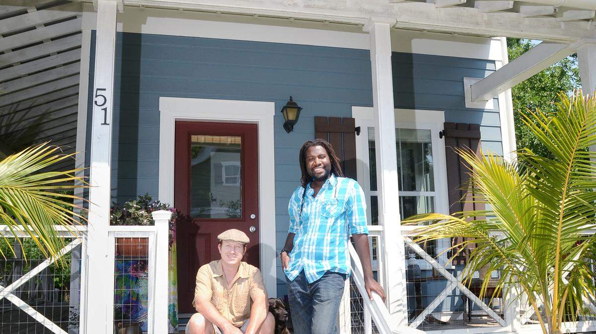 Homeowners Lee Fields, left, and Amiri Farris stand on their front porch May 6, 2014. Their house on Wharf Street was one of the affordable homes recently constructed by the town of Bluffton.