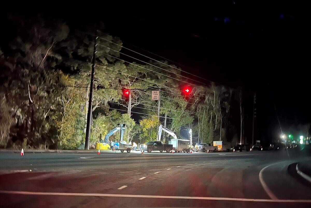 Workers with Beaufort-Jasper Water and Sewer Authority work Tuesday evening on repairing a failed sewer pipe at the intersection of Parris Island Gateway and the Savannah Highway.