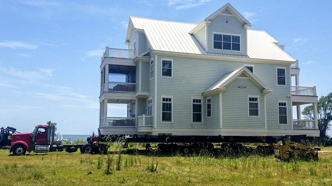 Watch how one family towed their home across a golf course, away from eroded SC beach