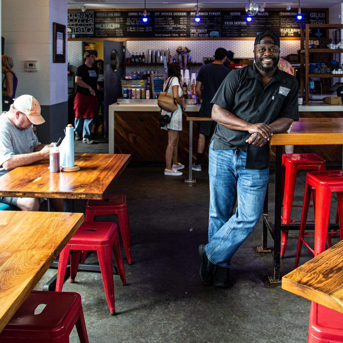 Rodney Scott, owner of Rodney Scott’s Whole Hog BBQ, poses inside of his Charleston store.