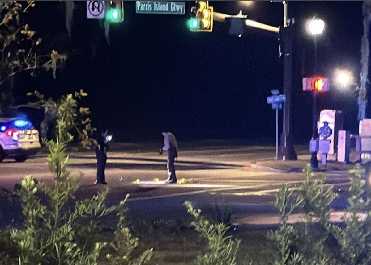 Law enforcement were seen viewing evidence placards on the scene of a Thursday night shooting at the intersection of Parris Island Gateway and Trask Parkway. The targeted vehicle crashed shortly after on Ribaut Road, leaving two teenage occupants dead.
